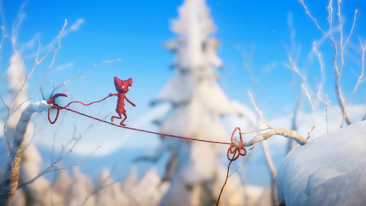 Yarny in a snowy winter landscape from Unravel, showcasing high-fidelity environmental textures and physics-based design.