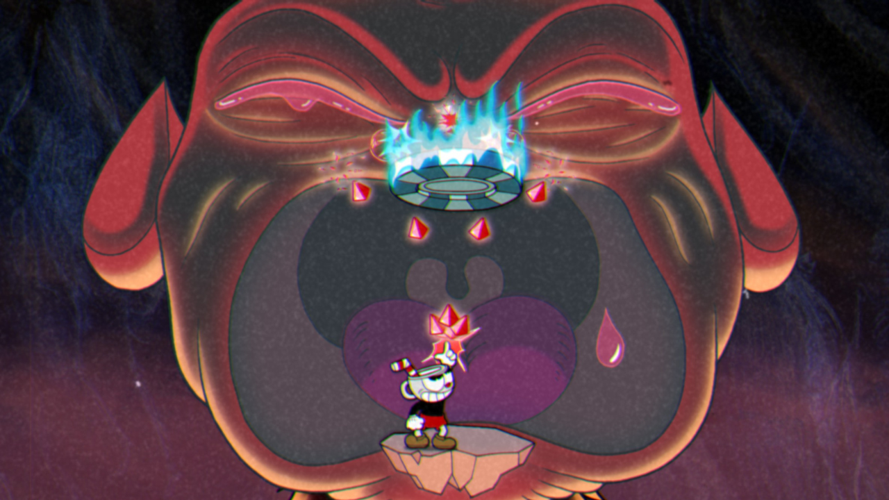 Cuphead hitting the weak point inside The Devil's mouth
