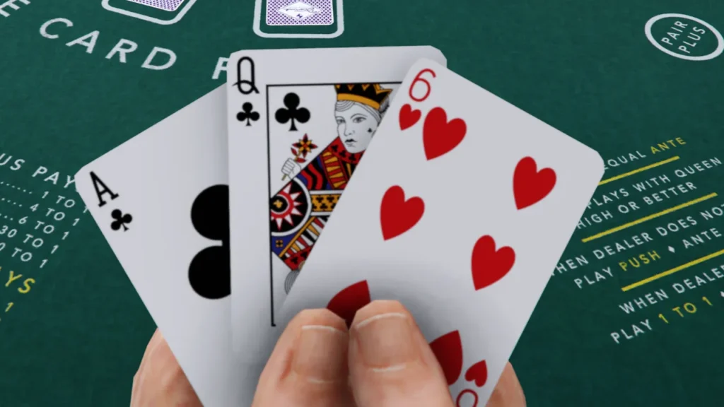 A hand holding an Ace of Clubs, Queen of Clubs, and Six of Hearts over a green casino poker table with game rules.