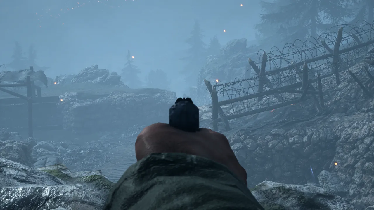 First-person view of a handgun aimed forward in a dense, foggy, rocky battlefield with barbed wire fences and distant fires.