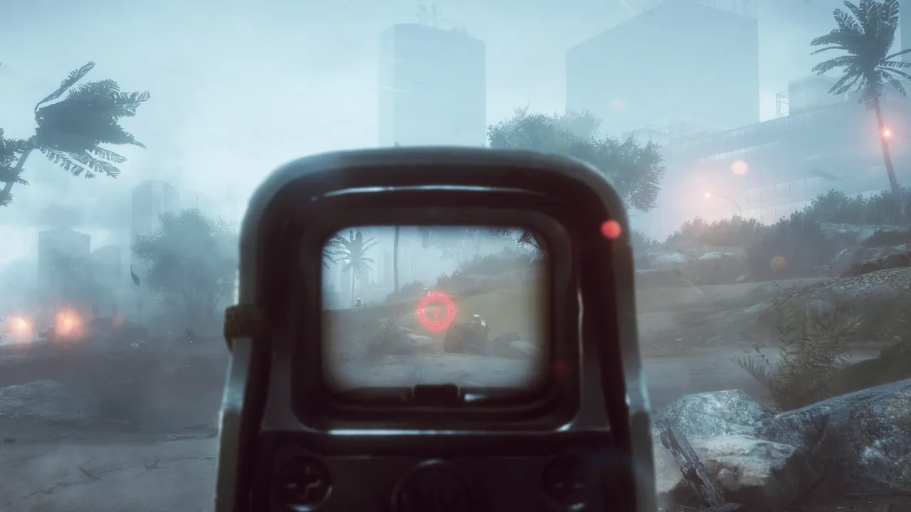 First-person view through a holographic sight in a stormy, urban environment, targeting an enemy amidst fog and palm trees.