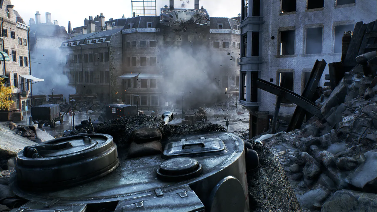 Dynamic urban warfare scene from a video game, showcasing a tank in the foreground, heavy building destruction with smoke and debris, highlighting realistic combat visuals.